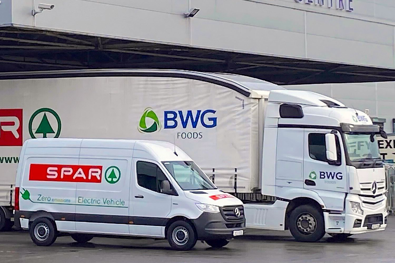 The Mercedes eSprinter with one of BWG’s existing CNG-powered trucks.